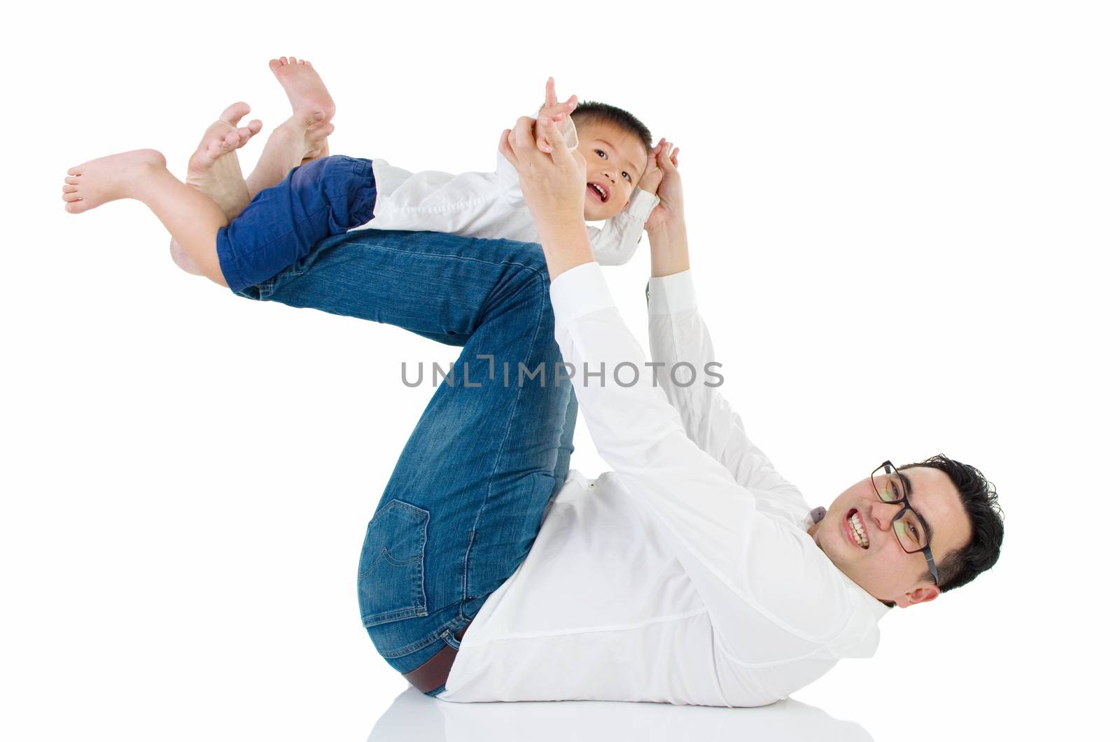 Asian father playing with baby boy