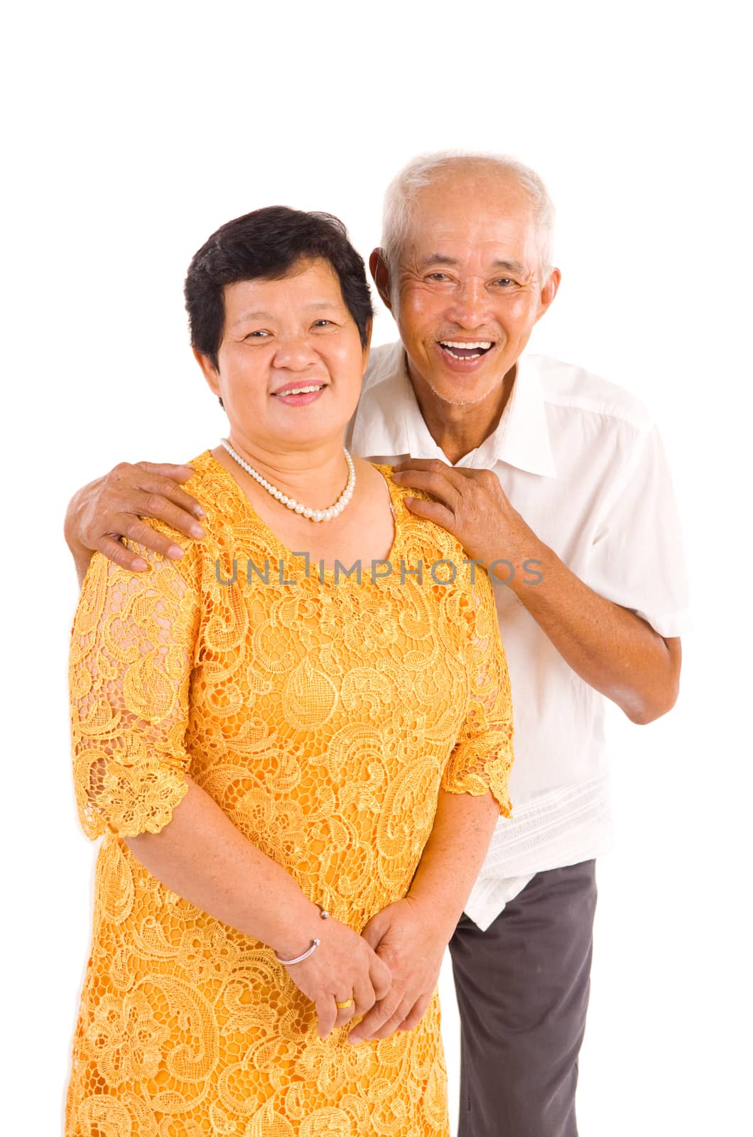 Happy senior aged Asian couple in love. Asian senior couple smiling isolated on white background.