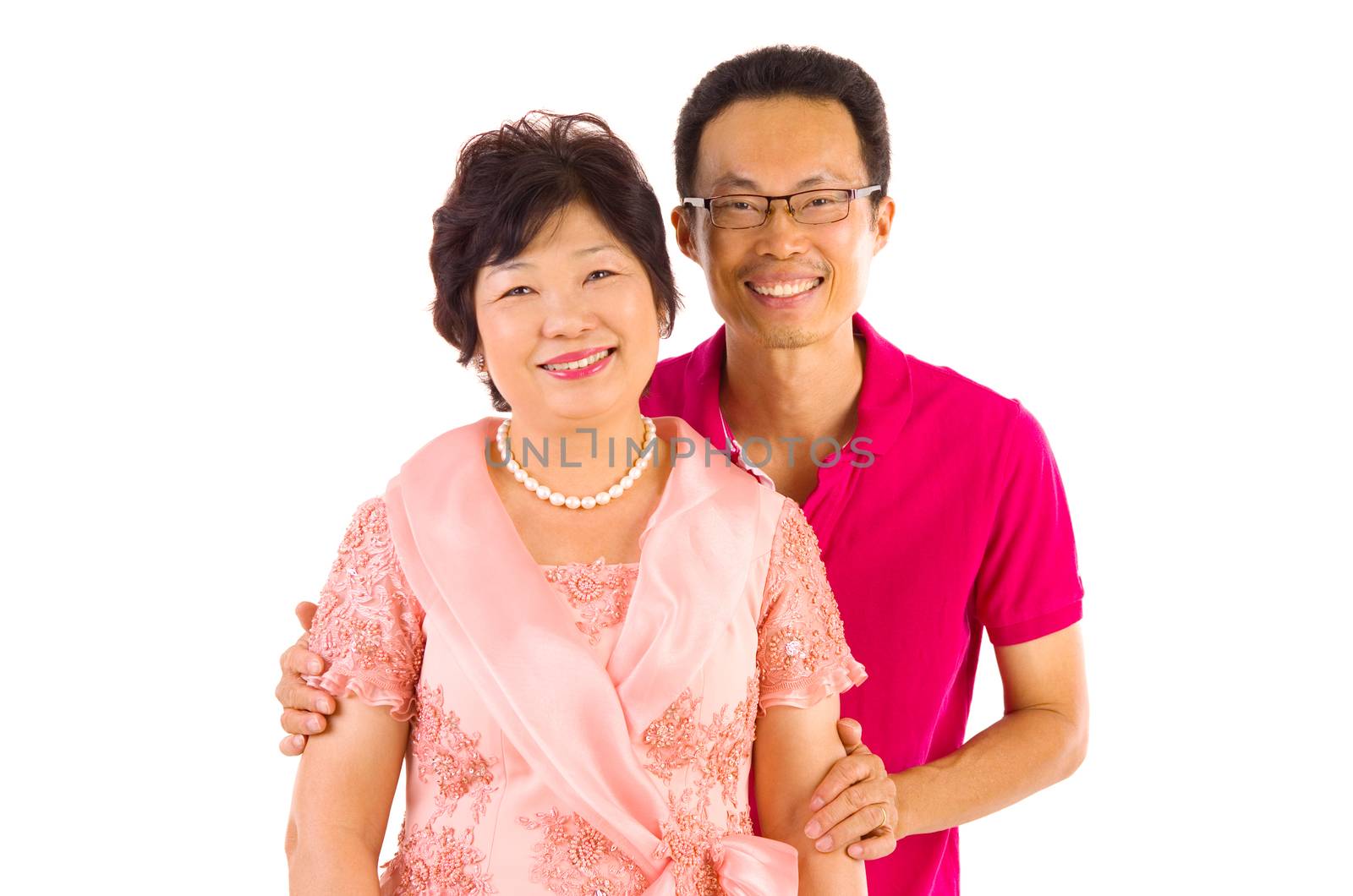 Asian mother and son. Happy Asian family mother and adult offspring having fun time at indoor studio.