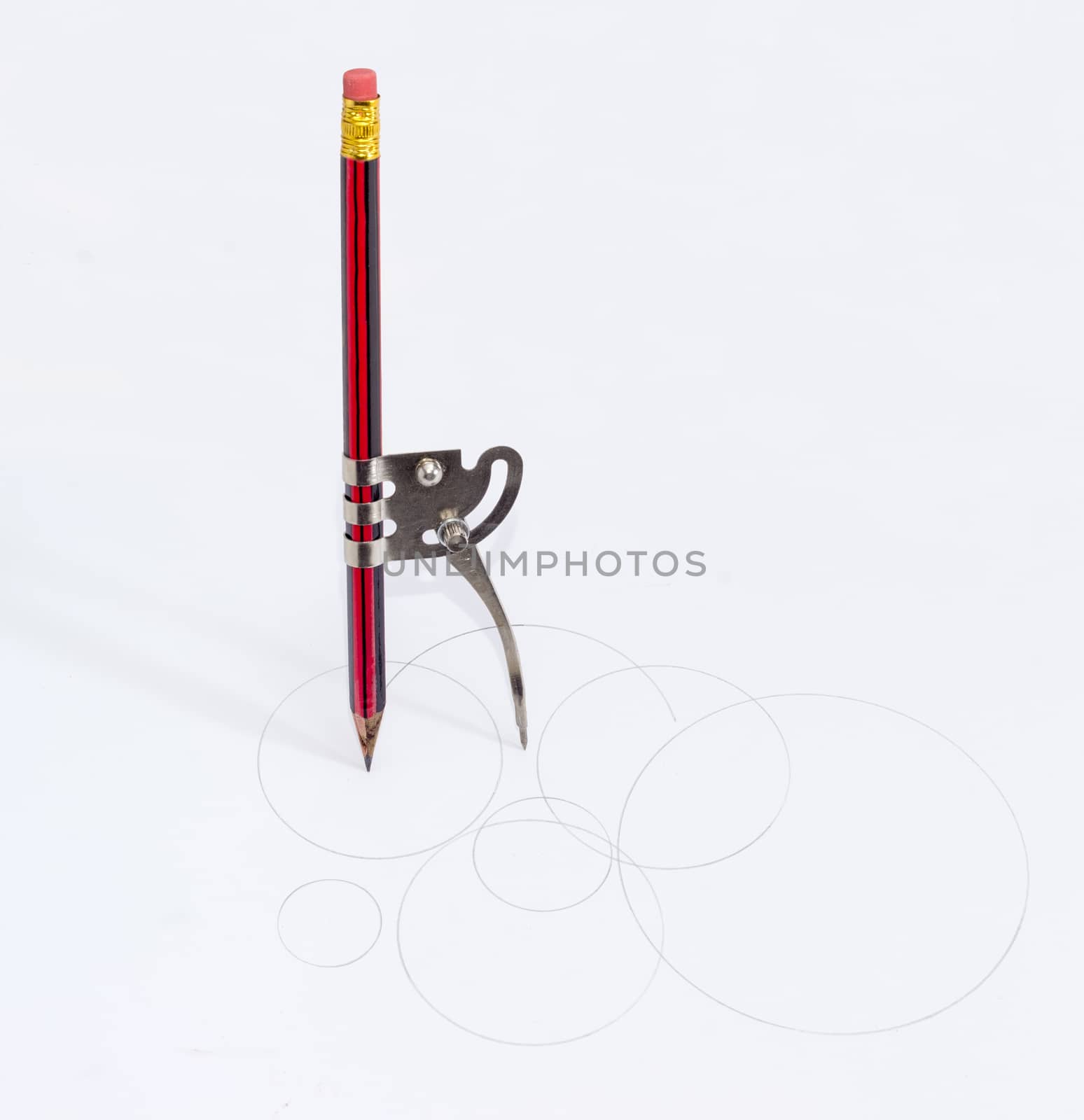 Simple school metal compass with an inserted pencil by anmbph