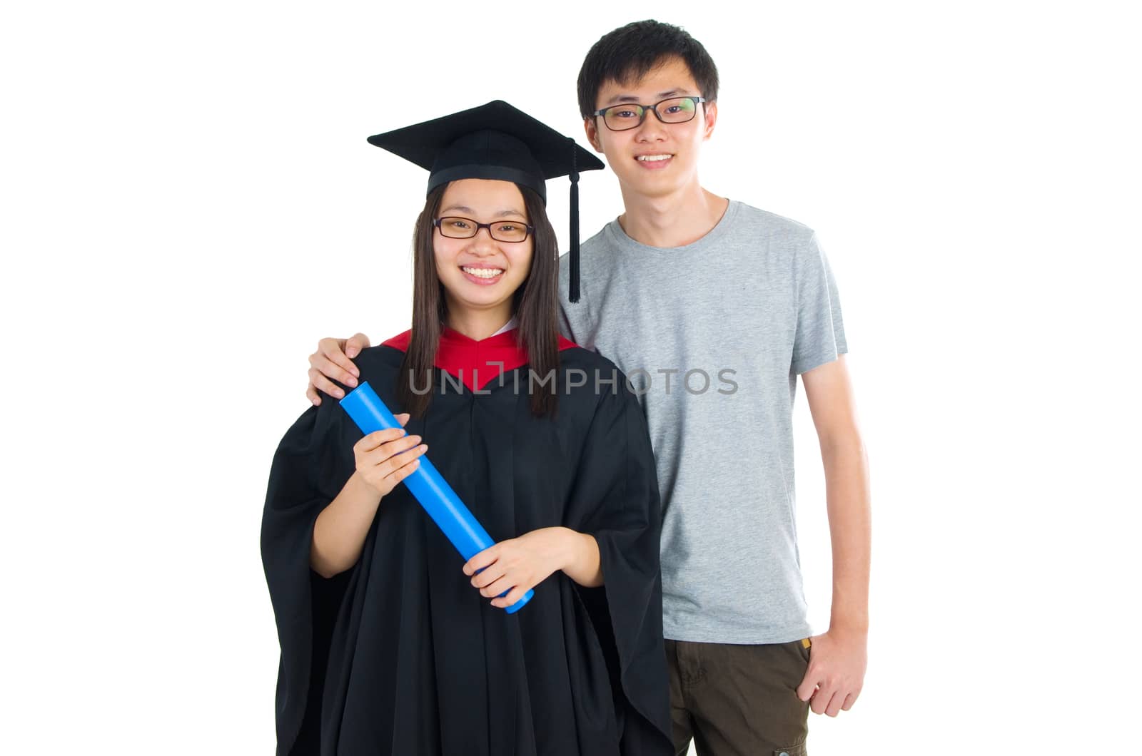 Asian university student and brother celebrating graduation