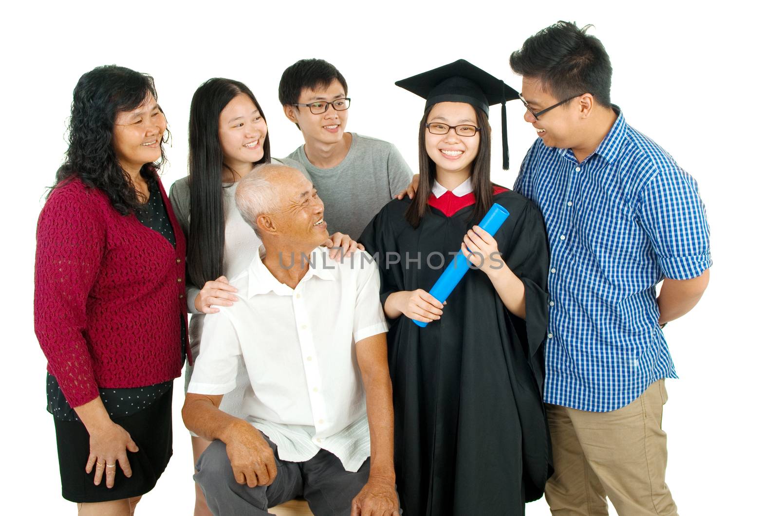Indoor portrait of beautiful asian family over white background