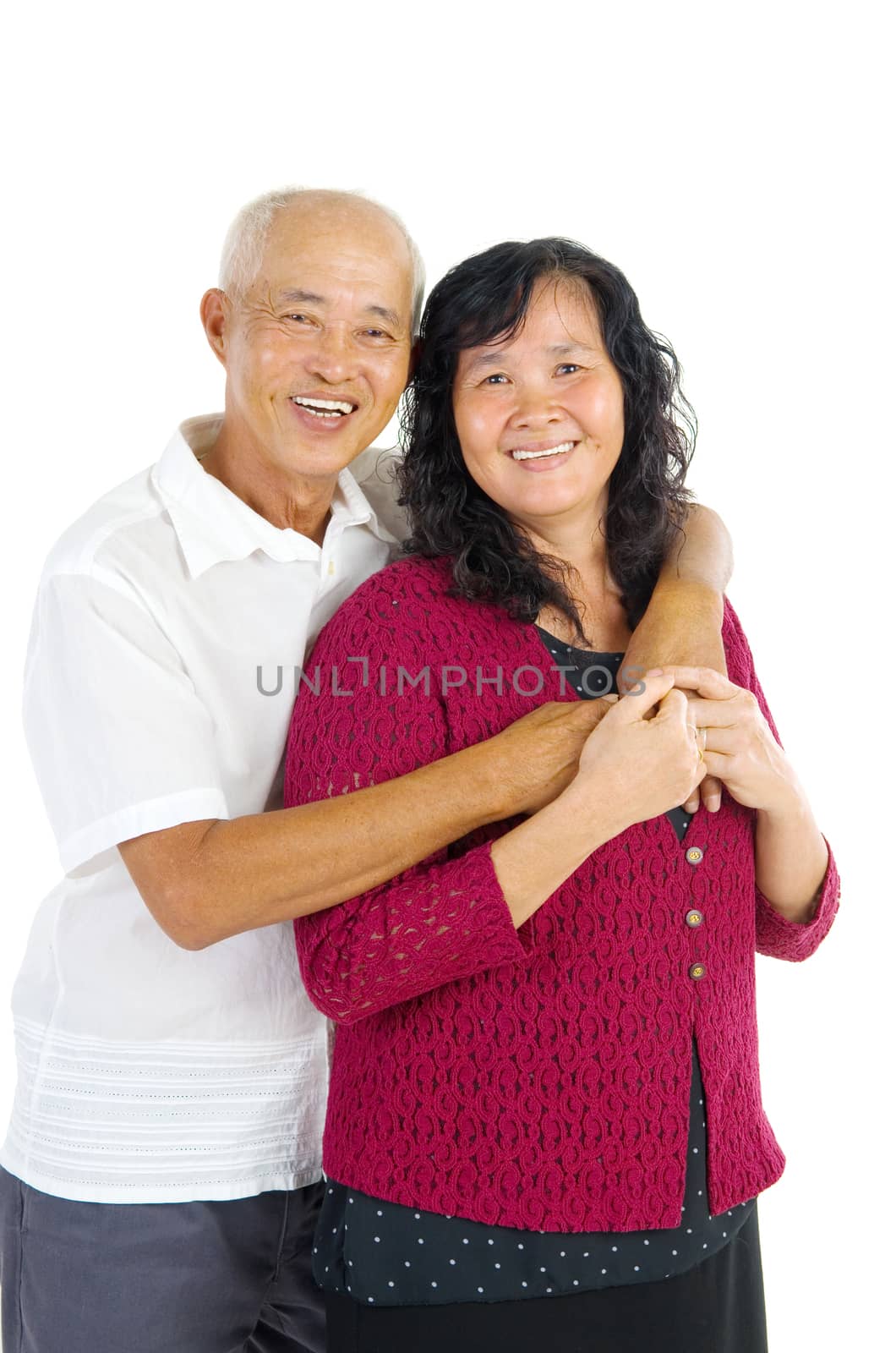 Happy senior aged Asian couple in love. Asian senior couple smiling isolated on white background.