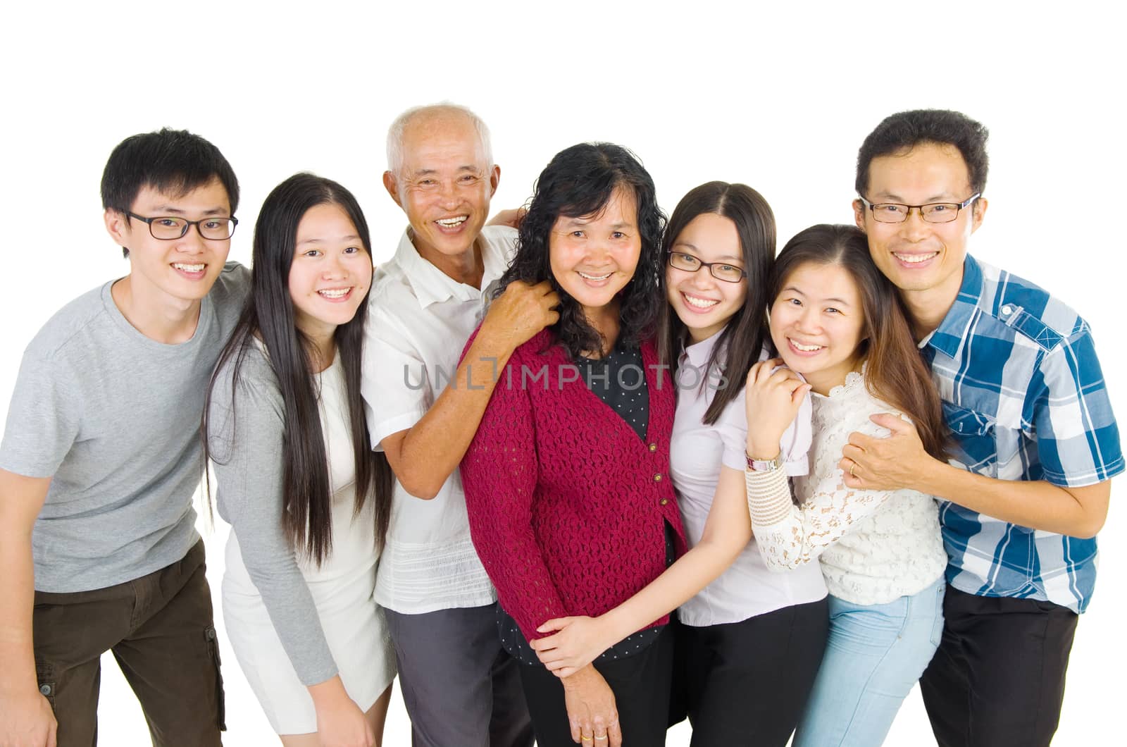 Indoor portrait of beautiful asian family over white background