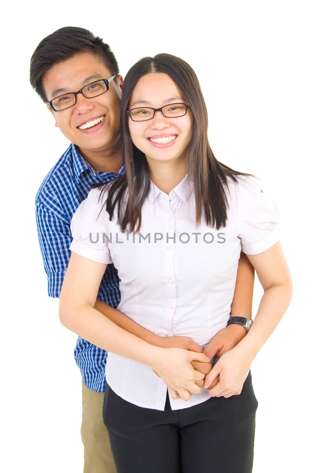 Young happy asian couple hugging and smiling