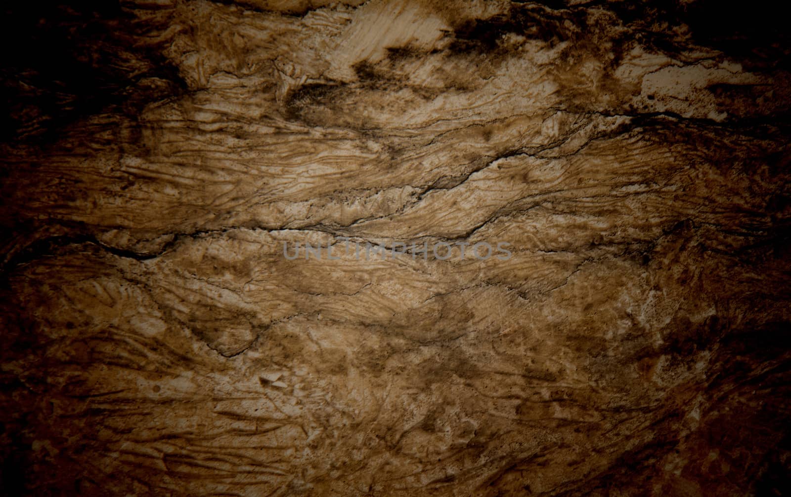 Vignetted stone wall background with lots of texture