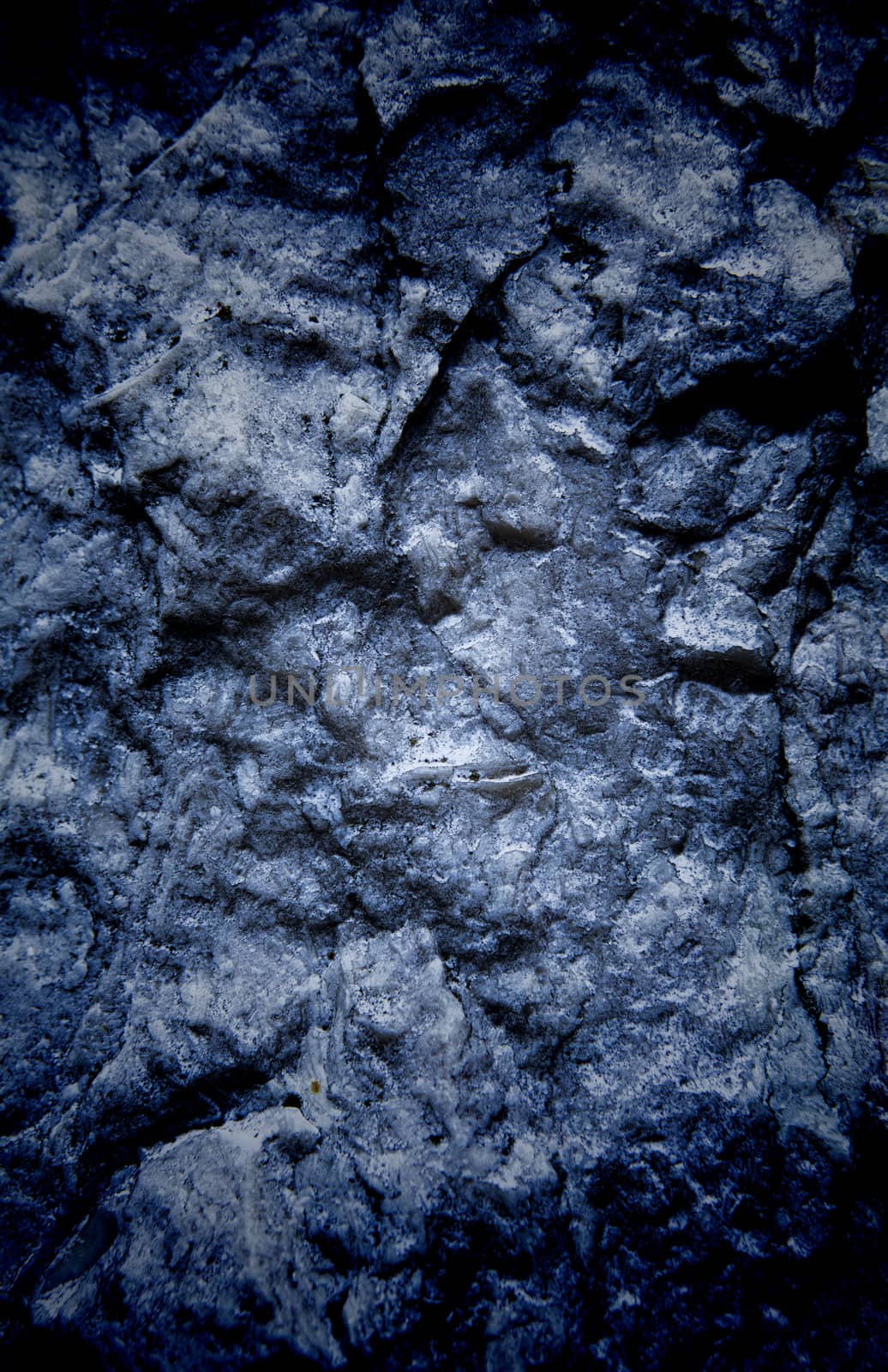 Vignetted stone wall background with lots of texture