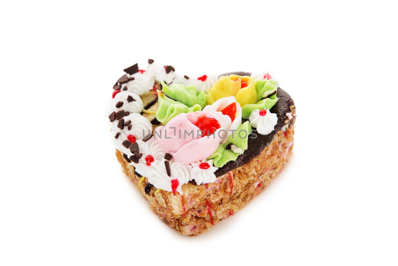 Chocolate cake in the shape of heart decorated with cream flowers isolated on white background. Confectionery, confection, pastry