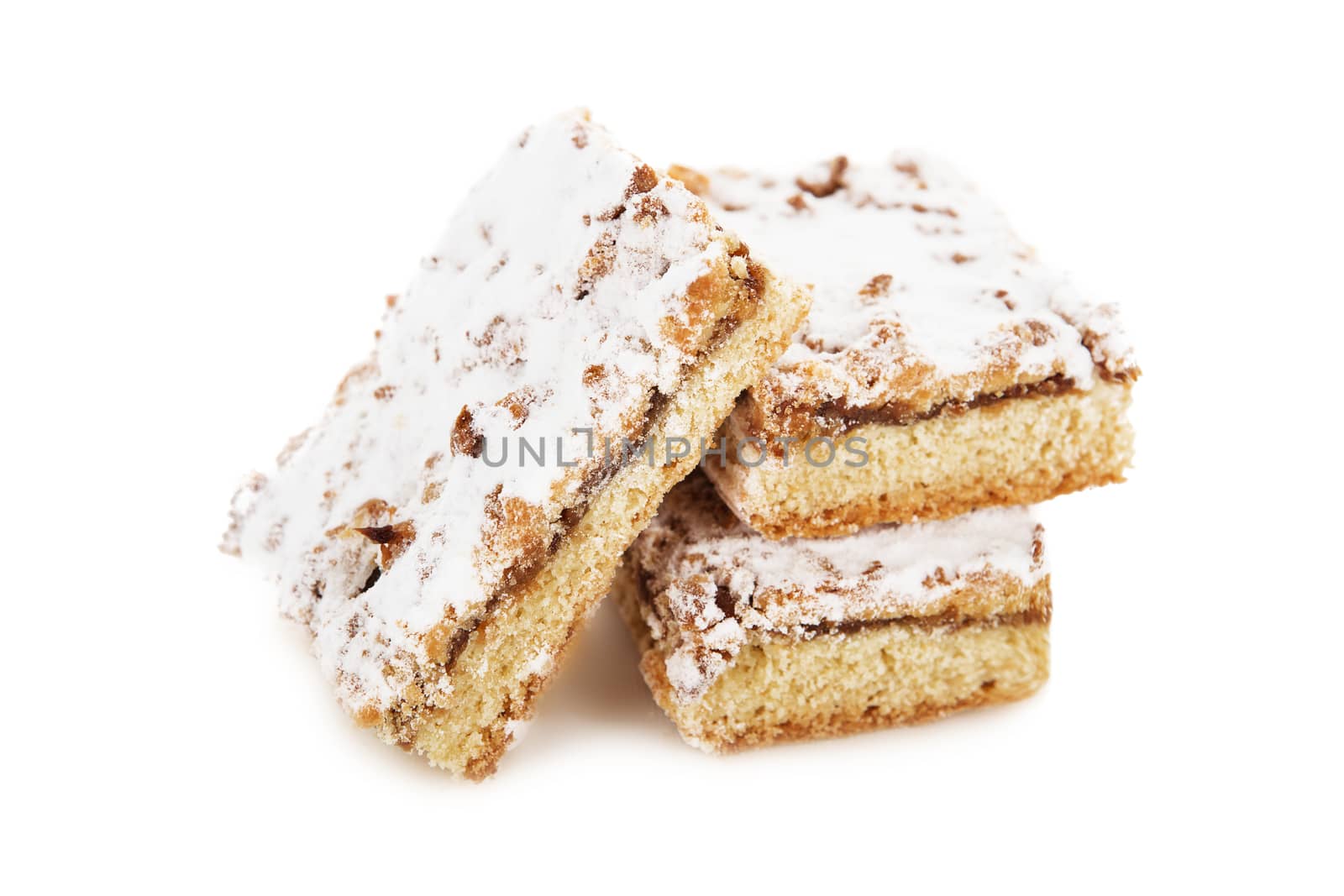 biscuit cake decorated with powdered sugar, castor sugar isolated on white background