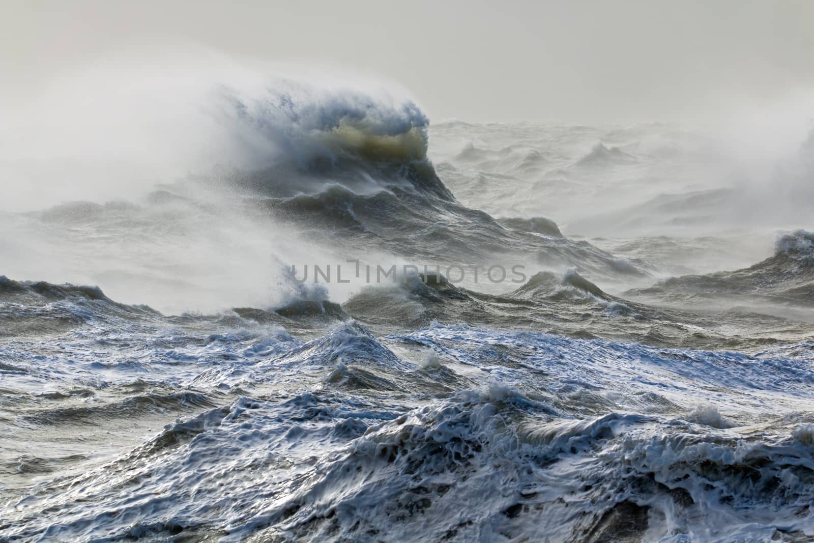 Storm Doris blowing spindrift from rough sea at Newhaven, East Sussex, during February 2017