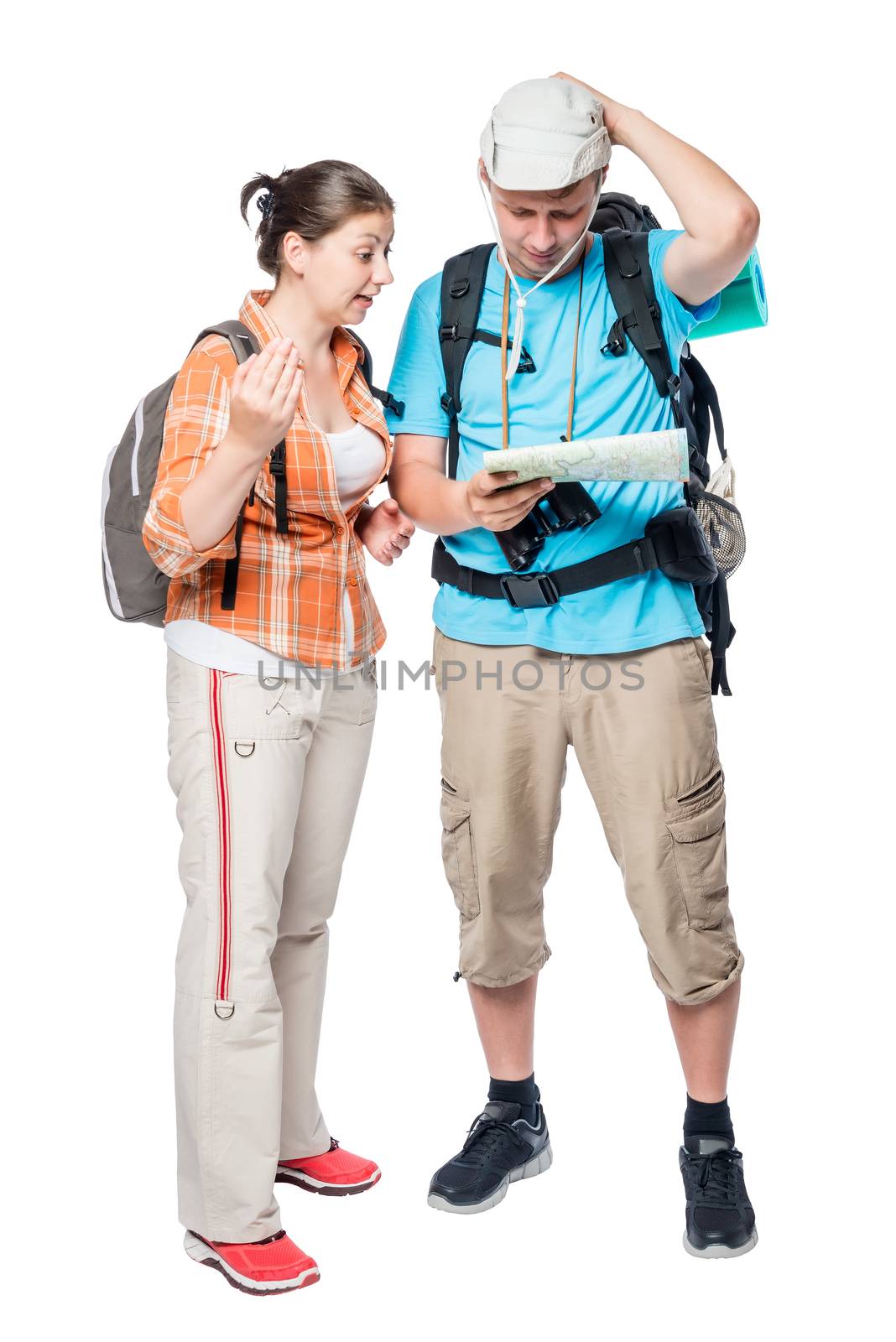 Two lost tourists look at the map on a white background in the studio