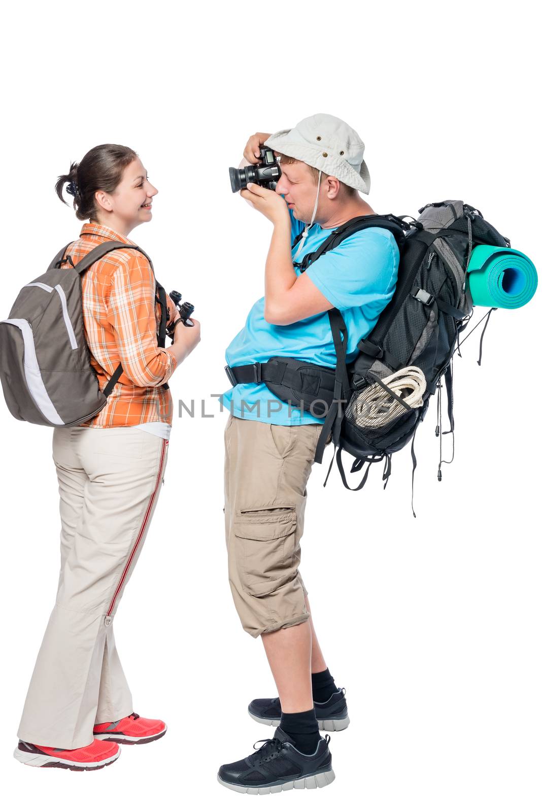 Man tourist with a backpack photographing his girlfriend isolate by kosmsos111