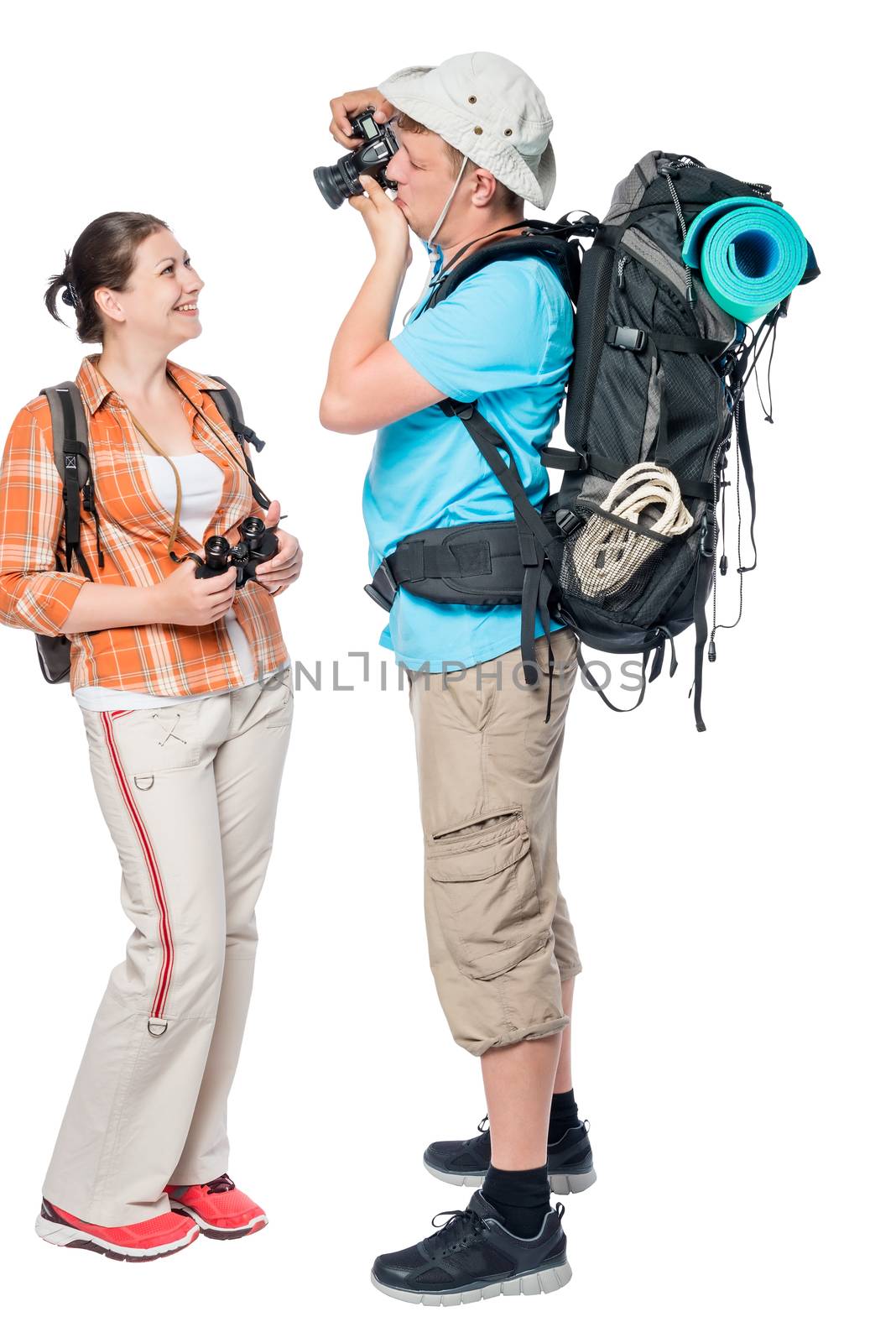 Model and man with camera tourists with backpacks on white background