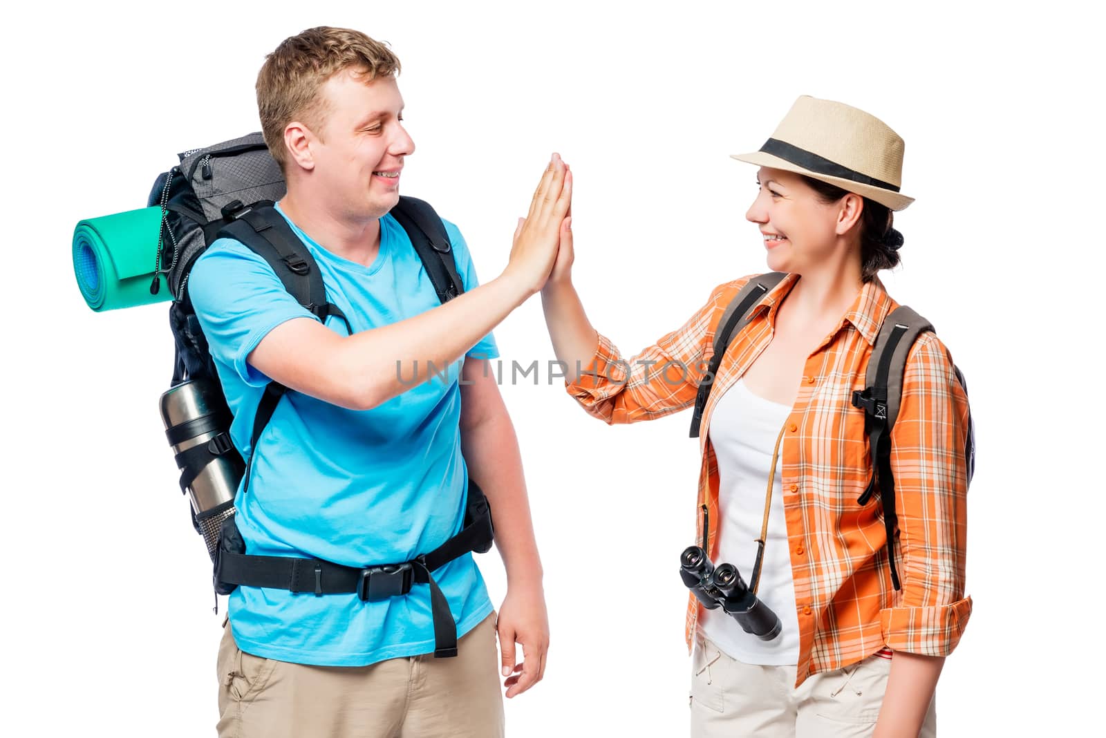 Successful and active tourists with backpacks, happy couple on a by kosmsos111