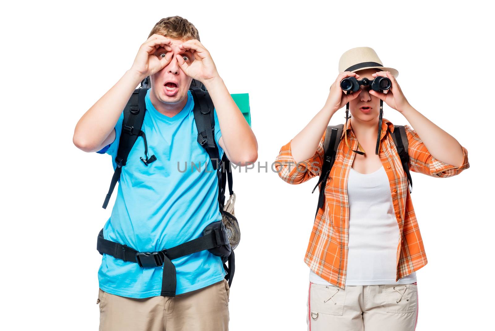 Young couple with backpacks looking in binoculars on white background