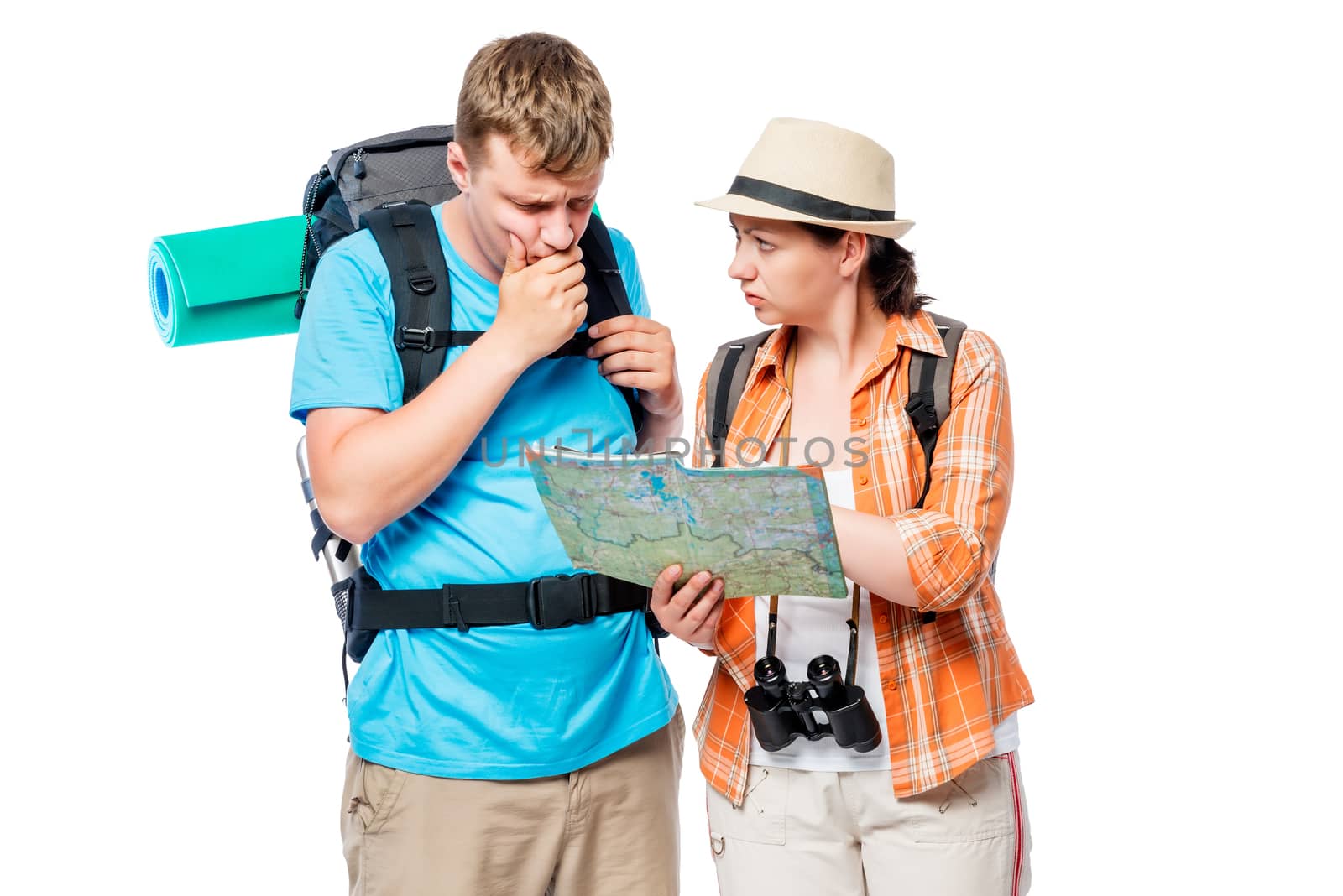 Thoughtful lost tourists looking at a map on a white background