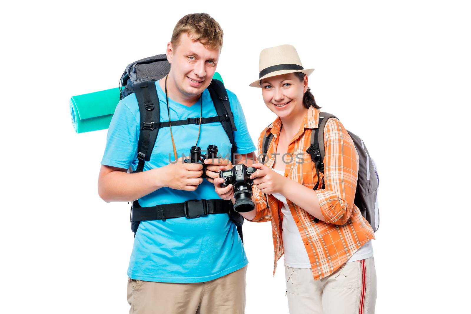 Cute young travelers with backpacks in studio by kosmsos111