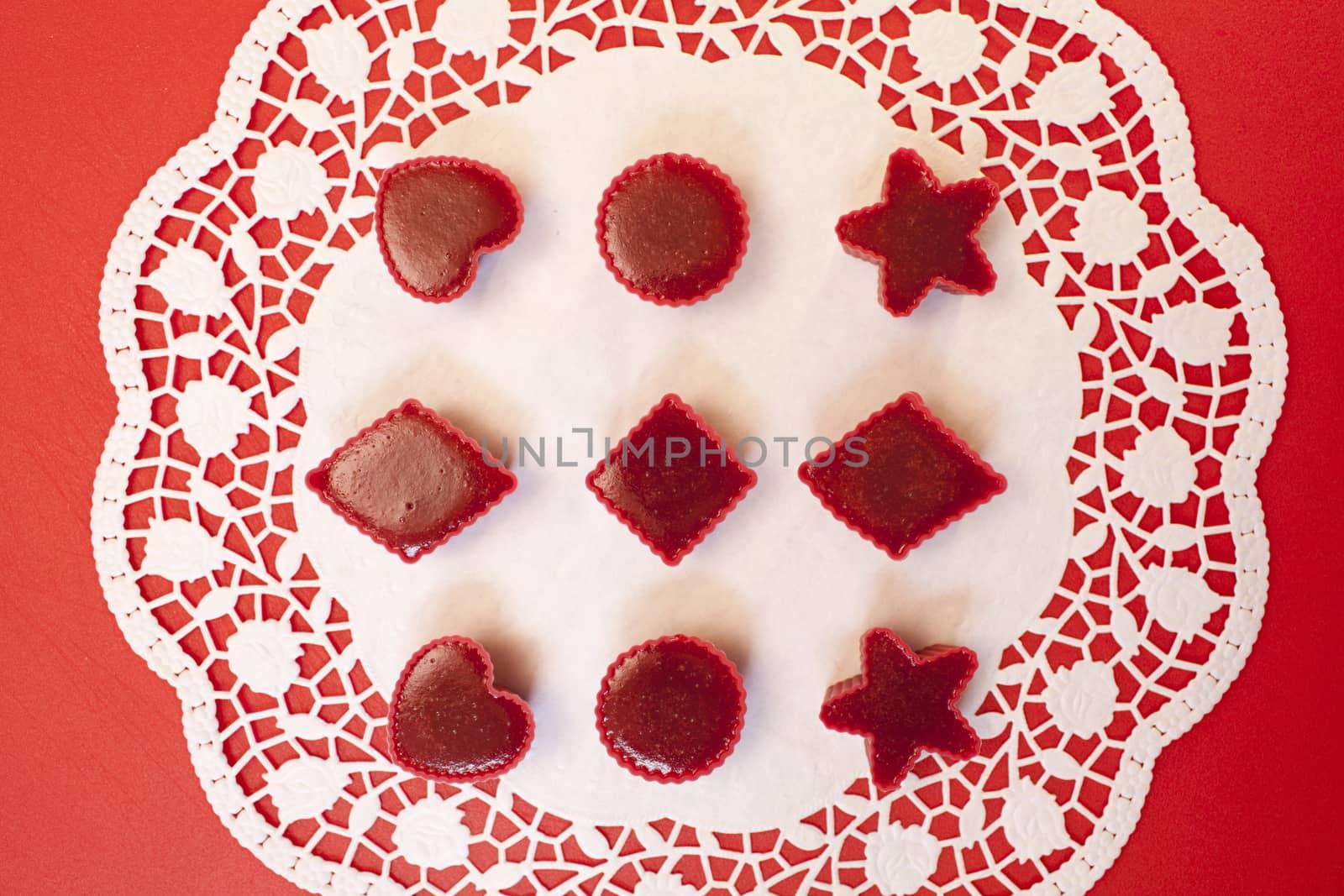 handmade Red marmalade in molds white napkin, overhead view