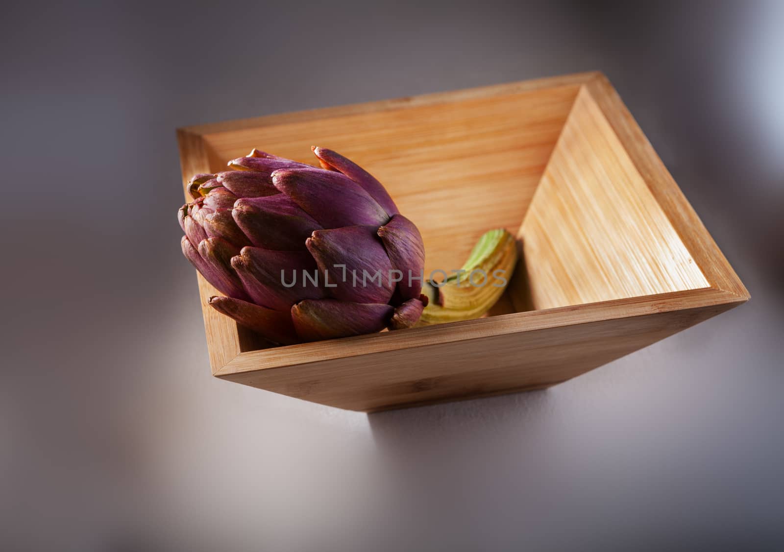 Fresh Artichoke in a square wooden plate. by supercat67