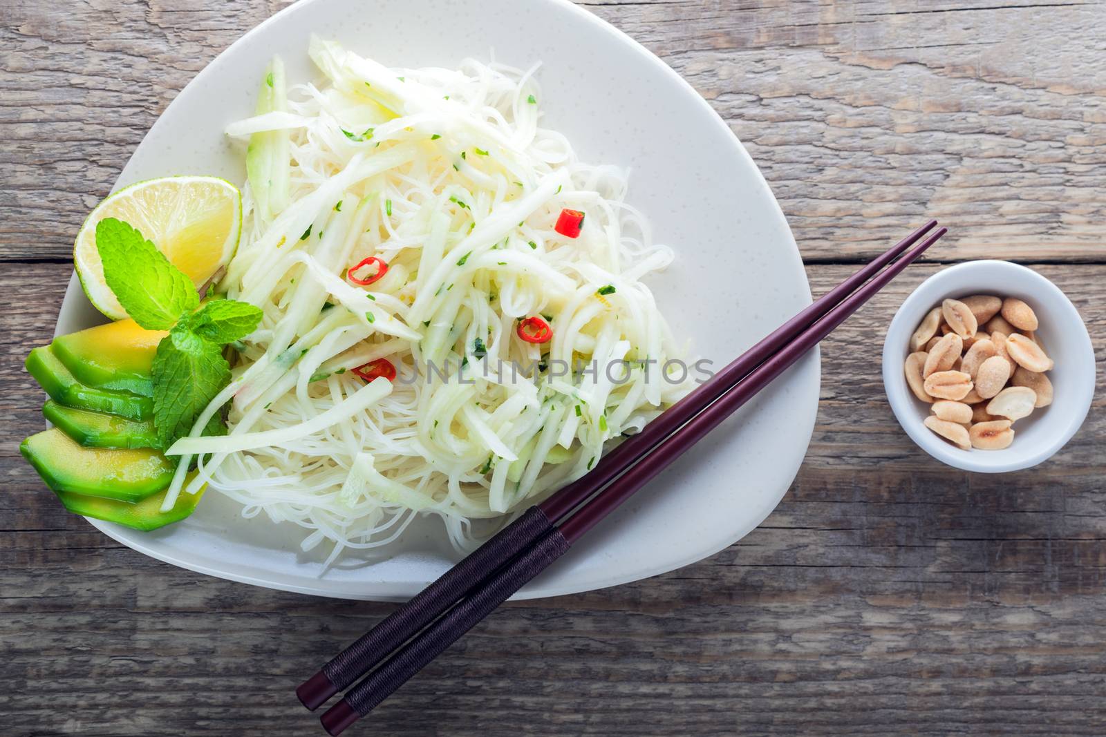 Spicy kohlrabi noodles, dressing: fish sauce, vinegar rices, lime garlic and ginger