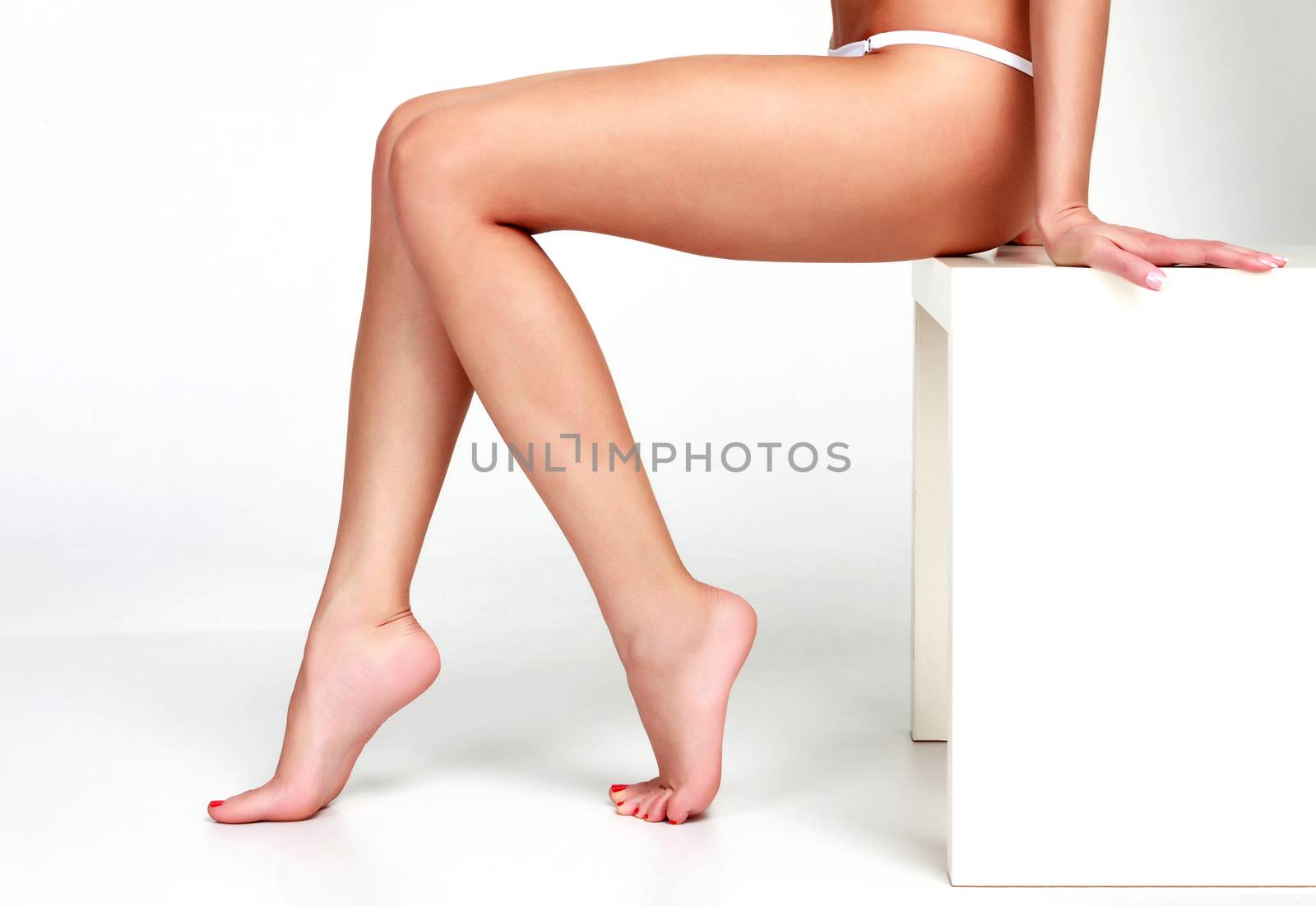 Woman legs on white background
