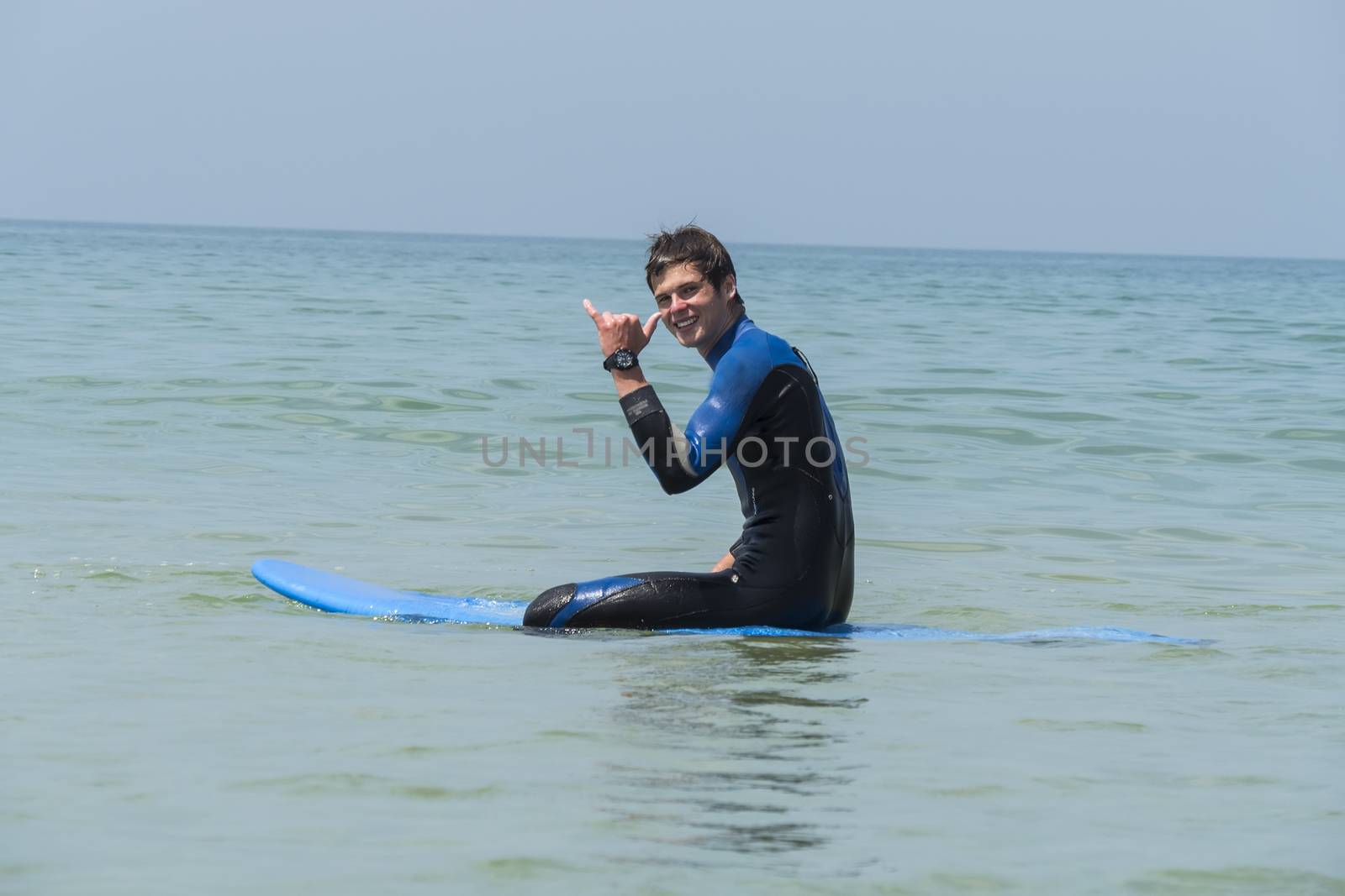 Young boy surfing in the sea