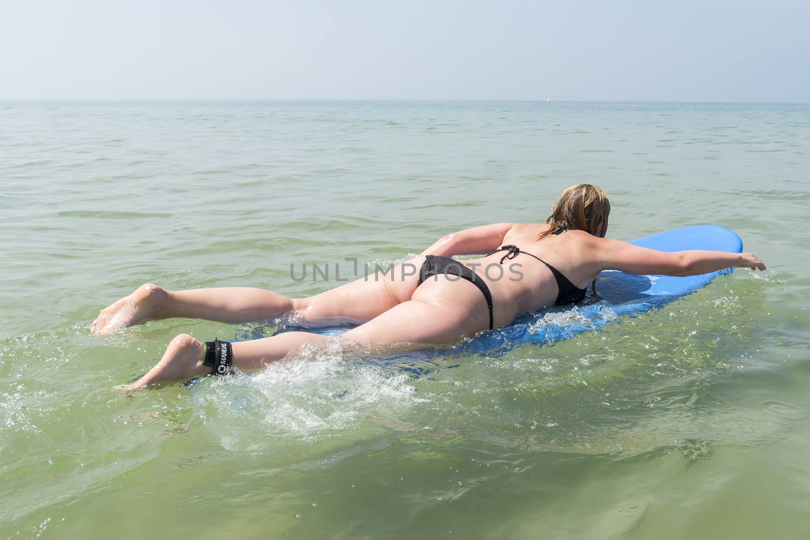 Young girl enjoying the surf and sea