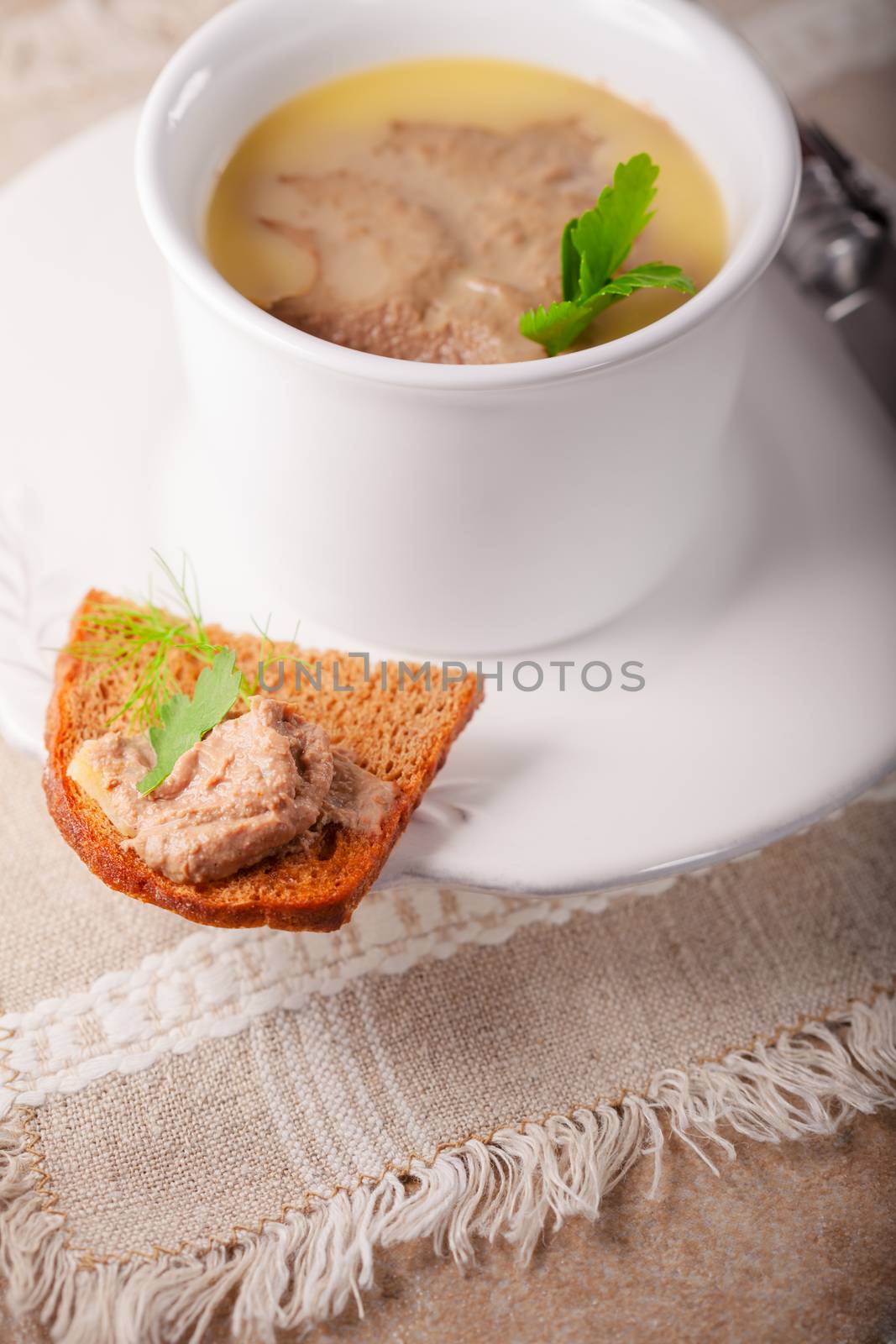 Home made chicken liver pate on a ceramic surface