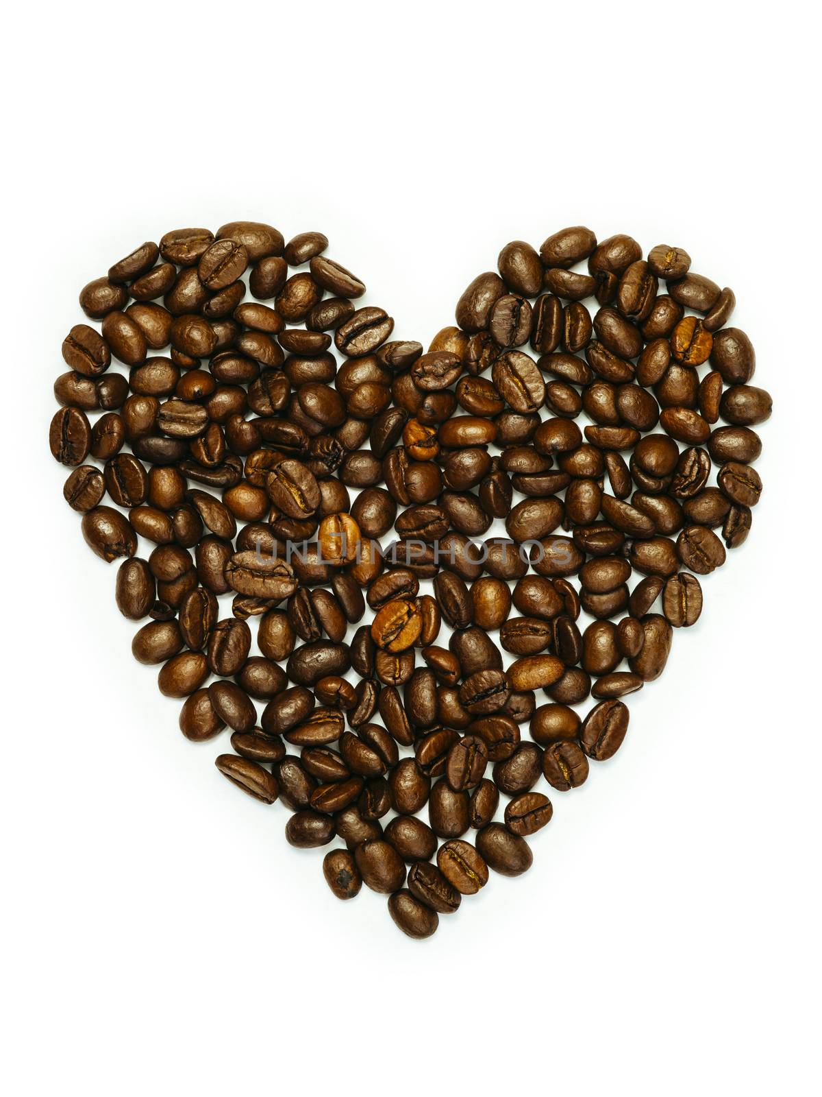 Photo of coffee beans in heart shape isolated over white background.