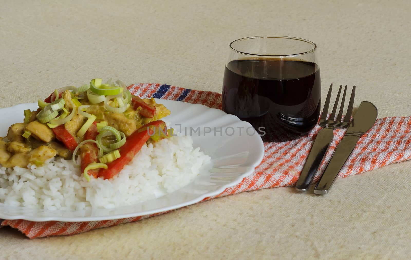 Vietnamese food - roast chicken meat with vegetables and rice on a white plate