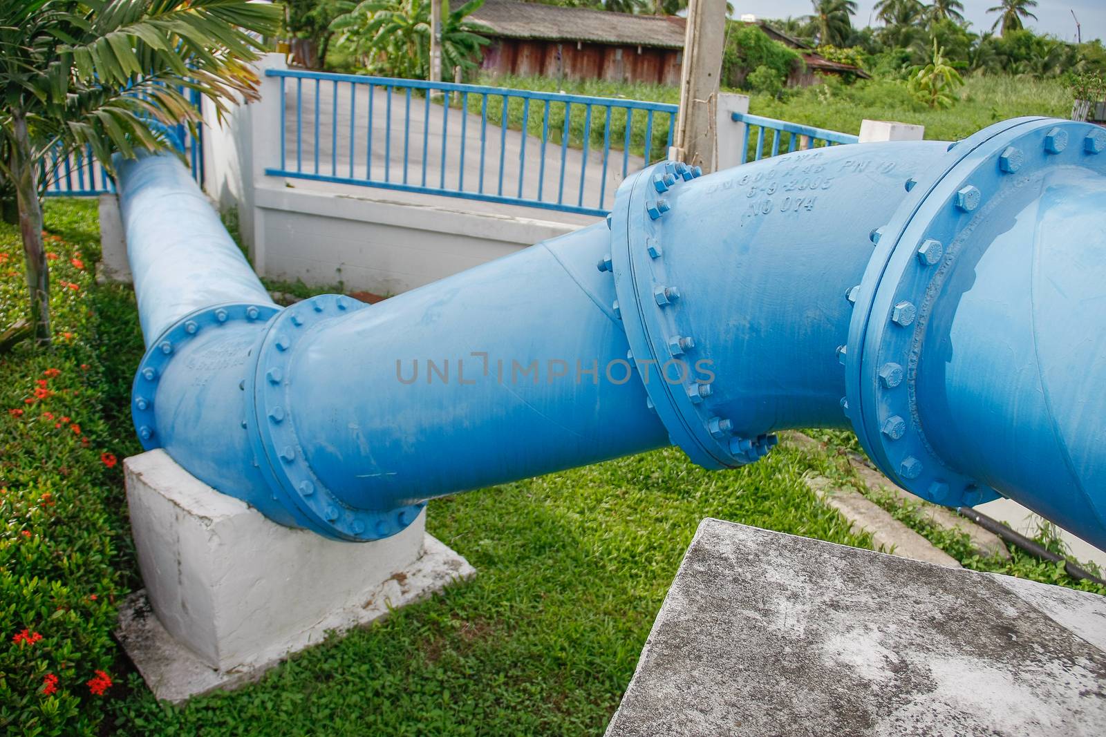 big blue Steel pipes and couplings of an irrigation water