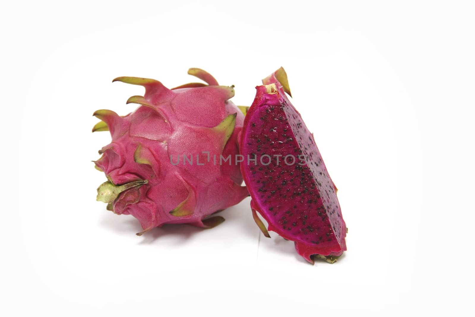 Purple dragon fruit on white background