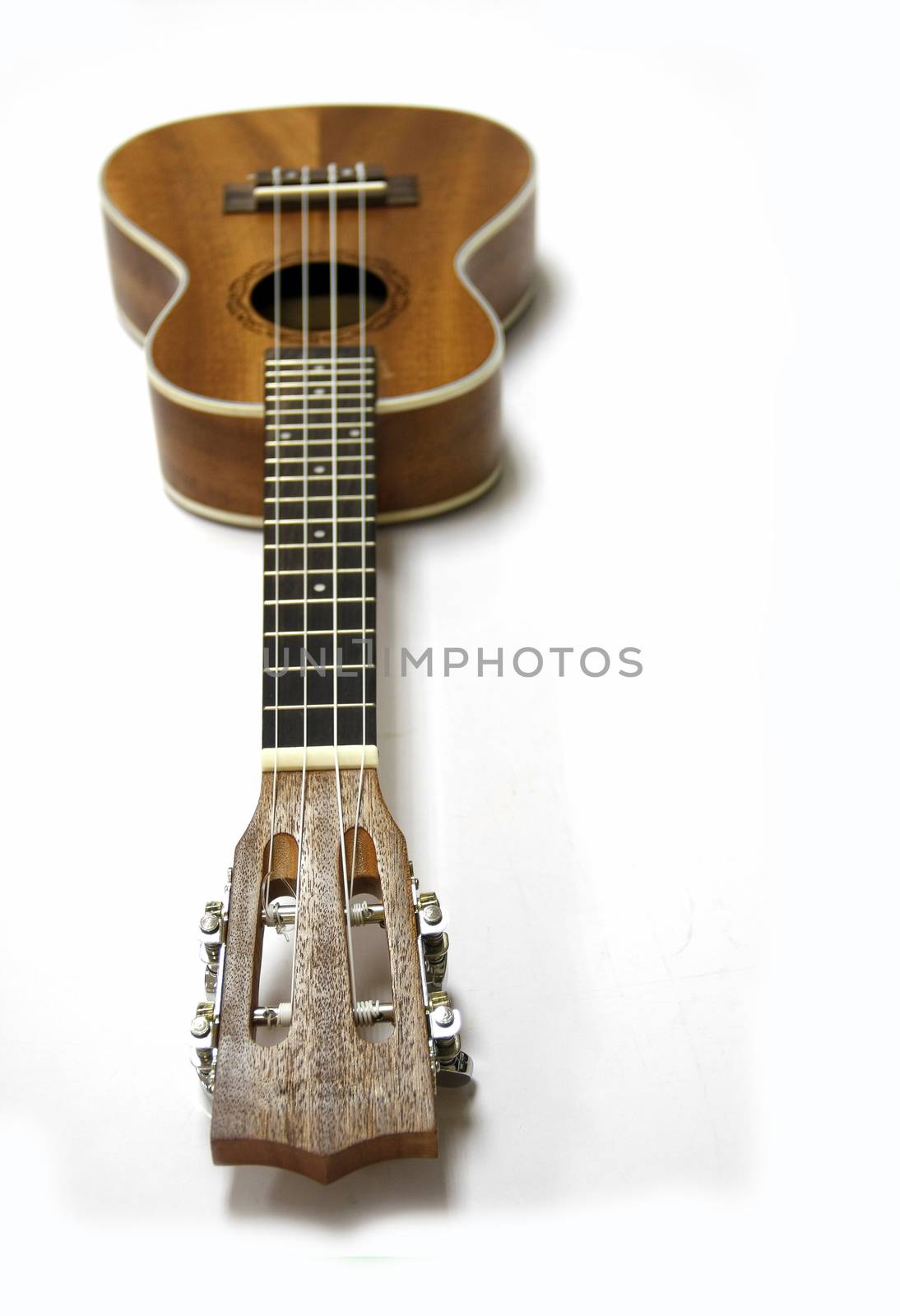 brown wood ukulele was strum musical instrument