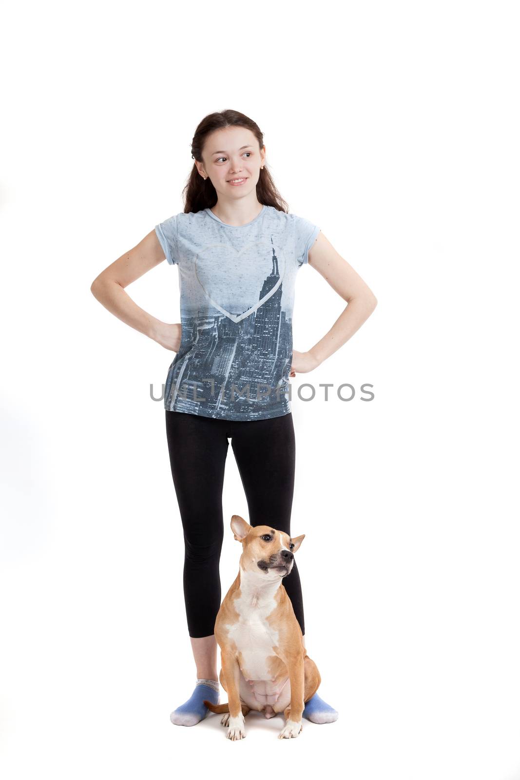 the young beautiful girl and her dog on a white background