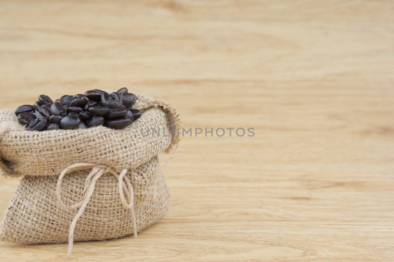 Close up stack of coffee bean in brown sack by eaglesky