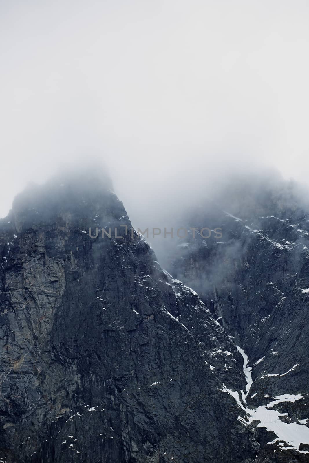 The Troll Wall in Norway, magestic summer foggy mountains