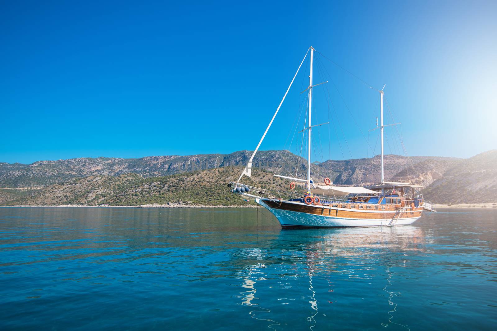 yacht on bay and castle in Kekova, near ruins of the ancient city on the Kekova island, Turkey