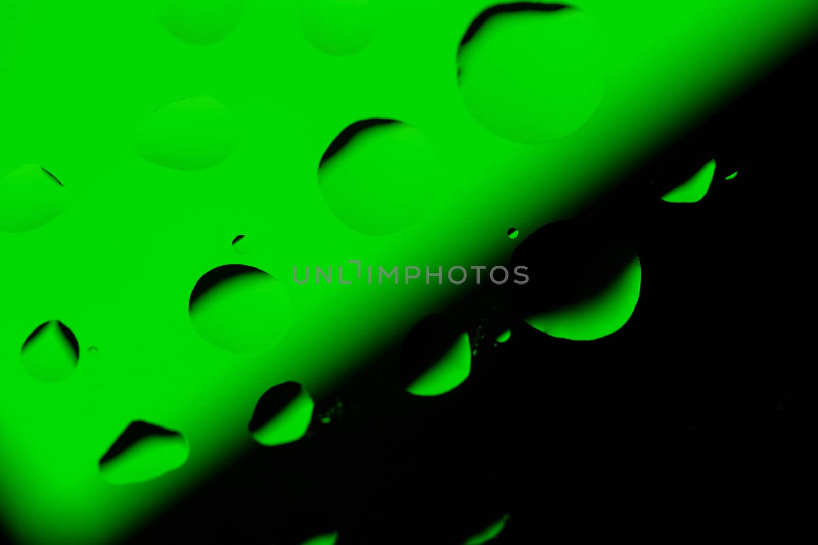 Abstract Background with Oil Drops on Black - Green