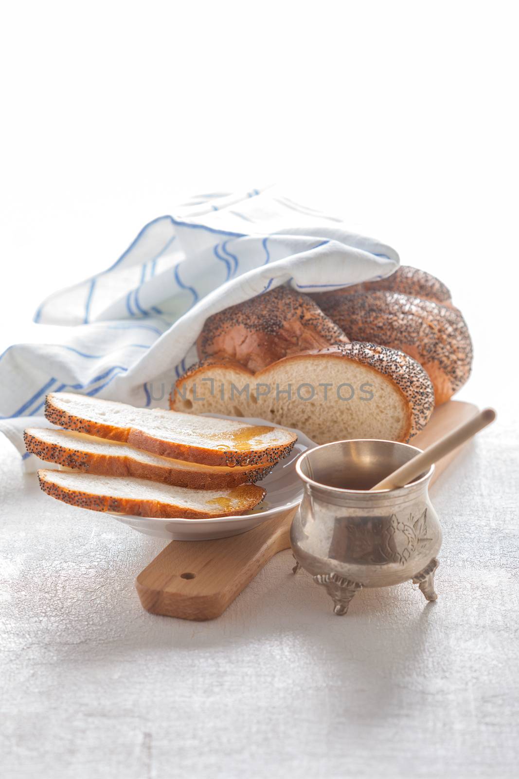 Braided Challah bread and honey  by supercat67