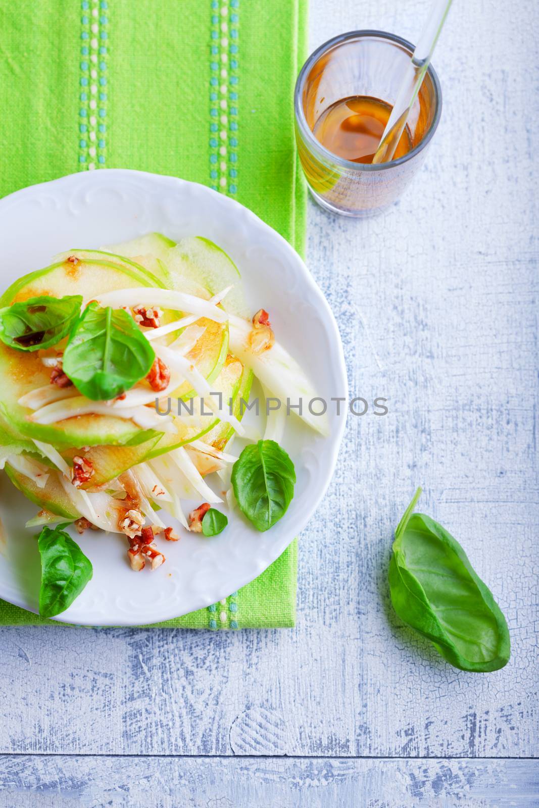 Fresh Fennel and apple salad on a white plate