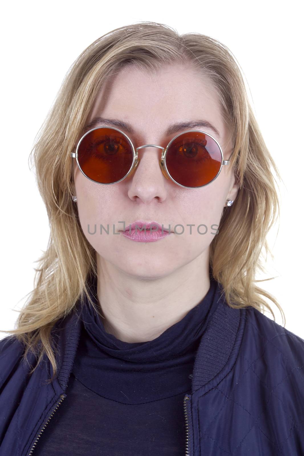 Portrait of young beautiful woman in the round sunglasses on light background
