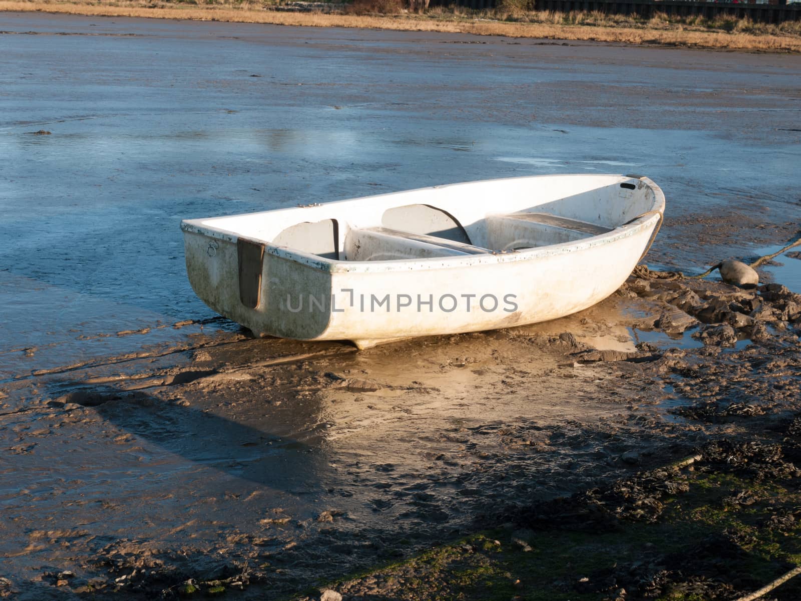 Boat in the mud with the tide out by callumrc