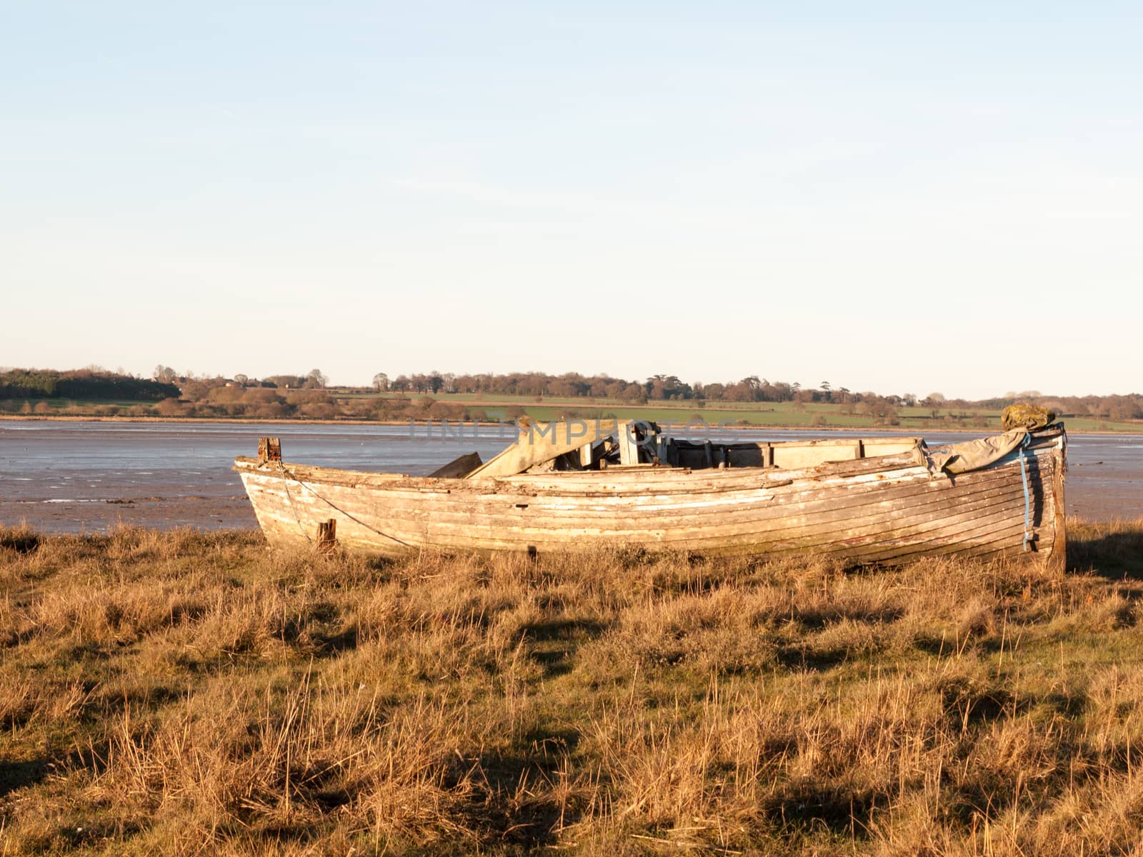 Boat in the mud with the tide out by callumrc
