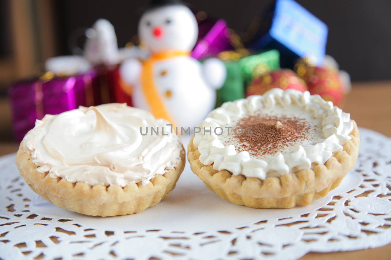 Two Delicious pie decorated with christmas new year setting by haiderazim