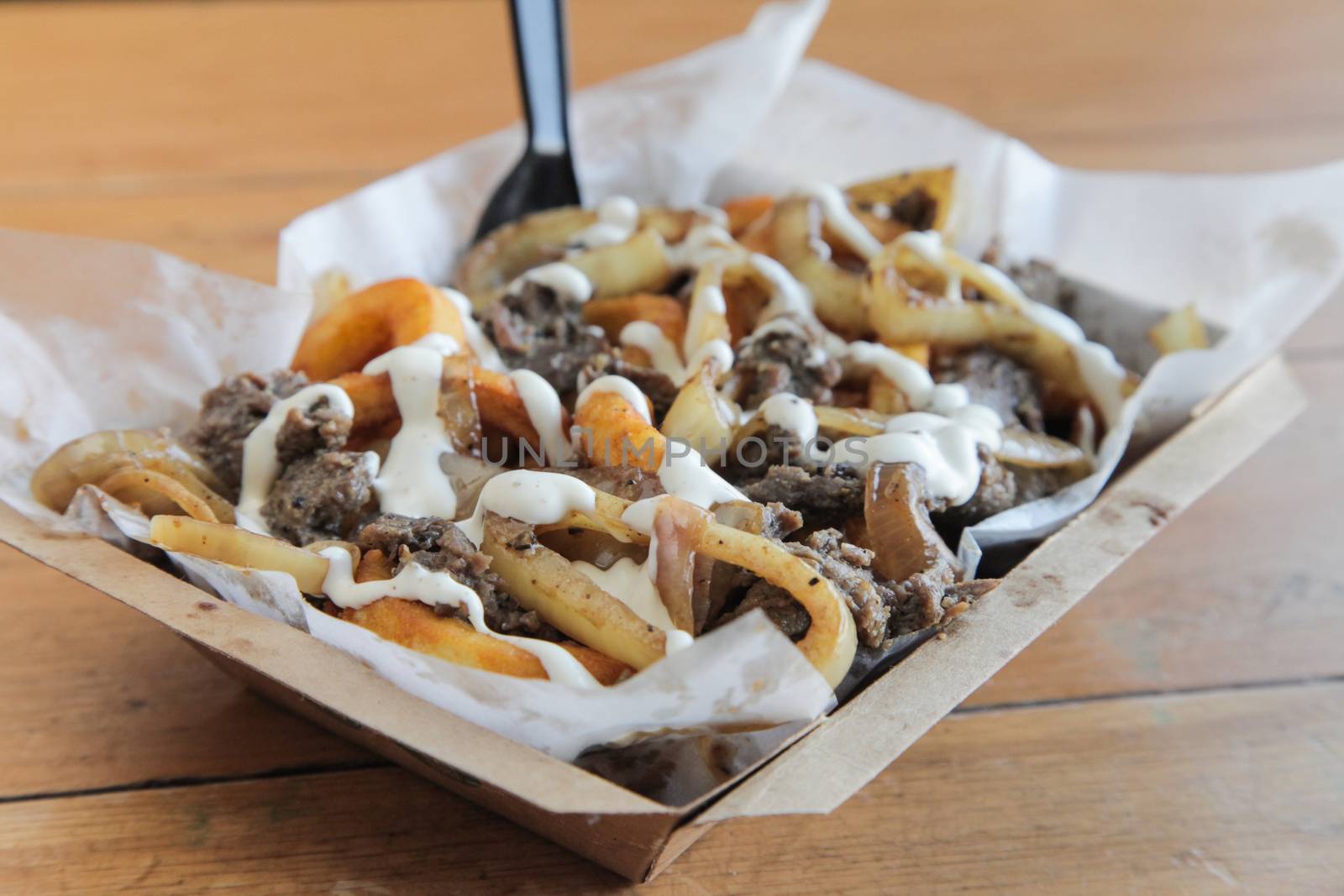 Poutine Curly fries with beef meat topped with cheese and mayo by haiderazim