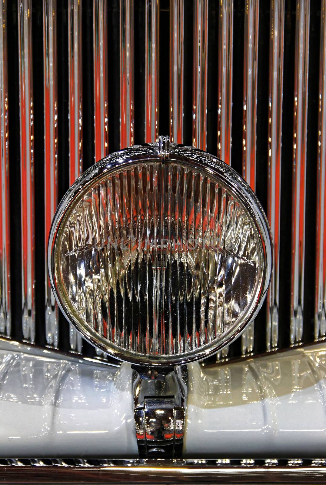 Old-timer shiny grille and close-up spotlight.