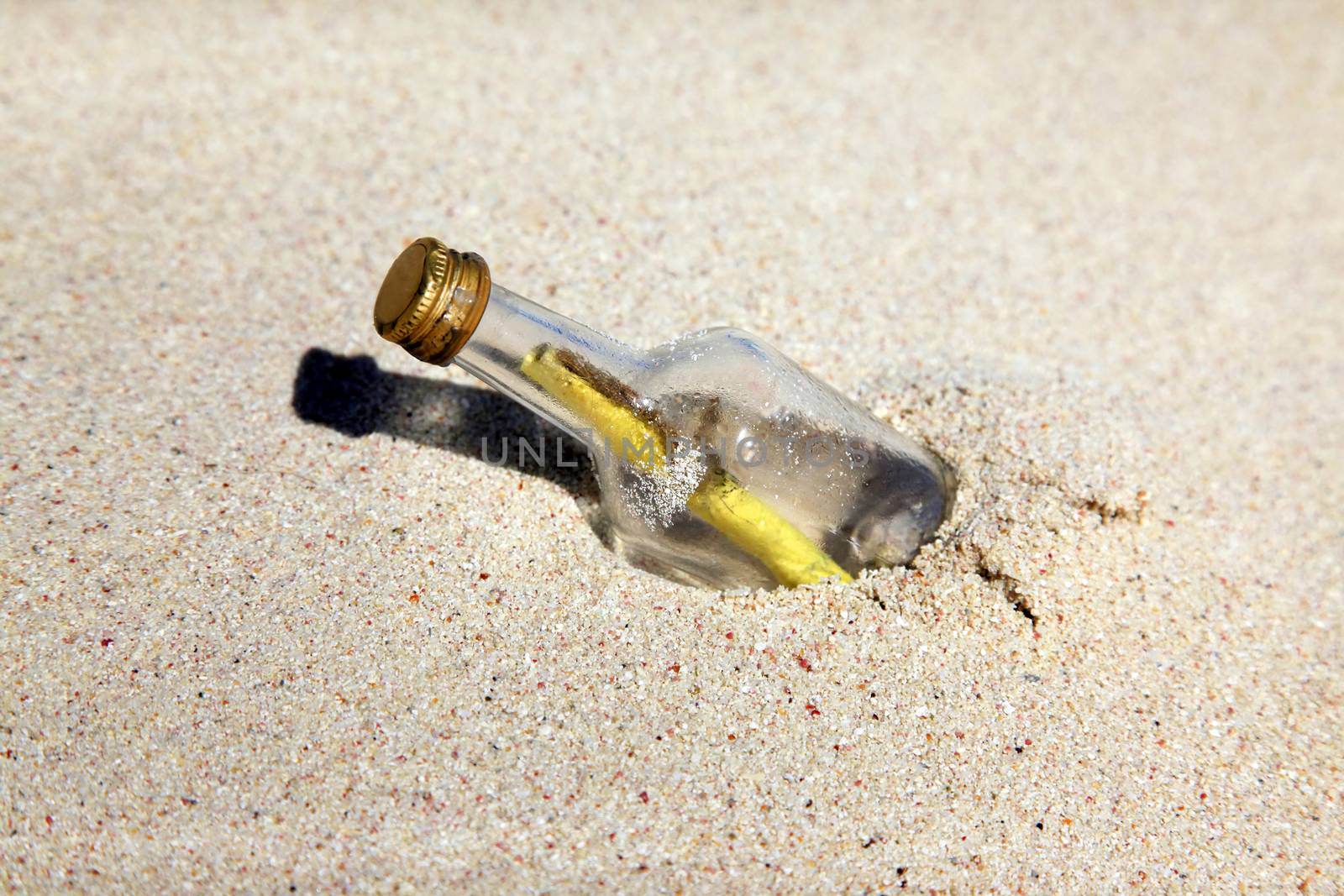 Message in the bottle on sand beach