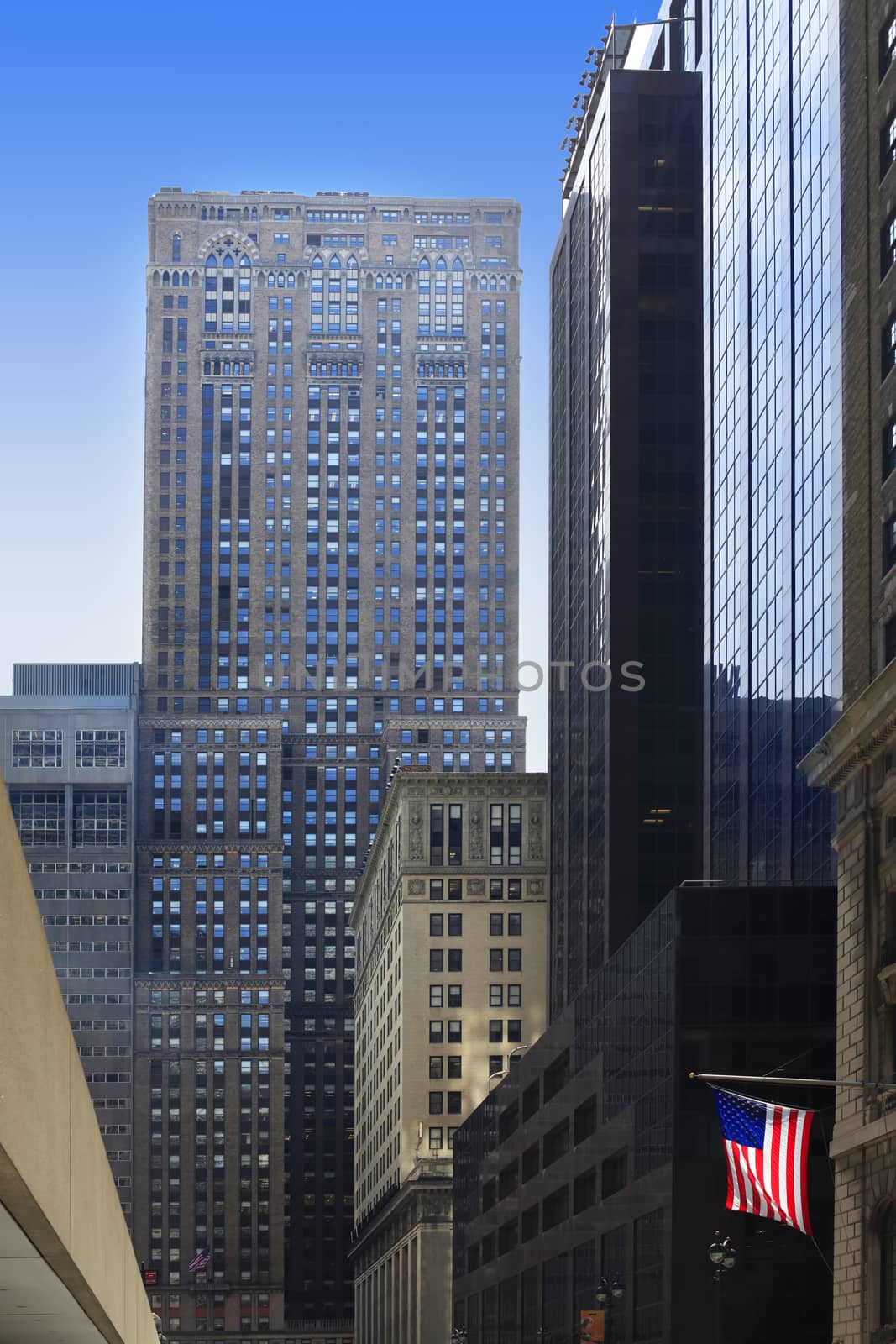 Buildings on the Manhattan with the American flag. New York City.