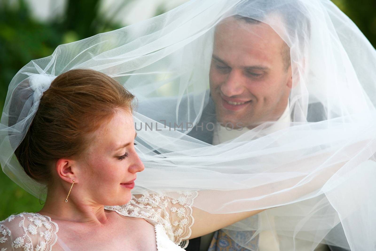 The groom and the bride in park