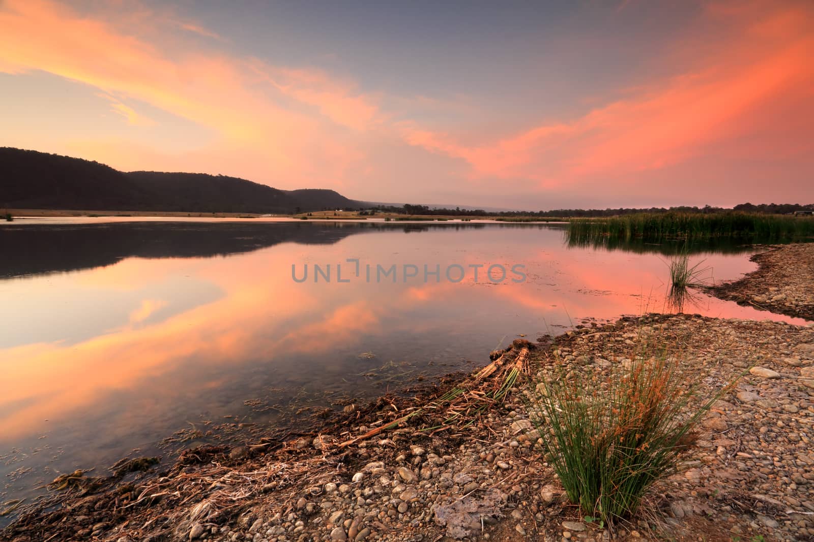 Summer sunset from the banks of Boorooberongal, views north with Blue Mountains in silhouette.  Castlereagh, Penrith